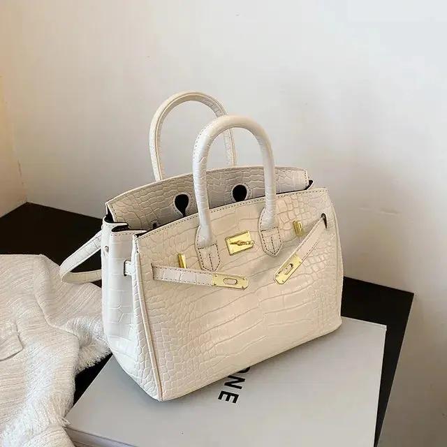 Spacious Women's Handbag with Multiple Compartments and Adjustable Strap